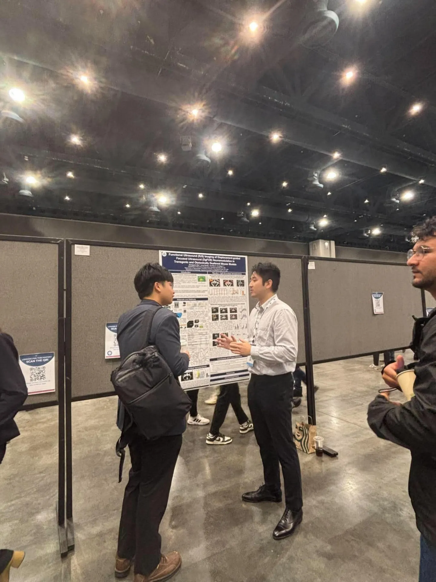 student presenting poster