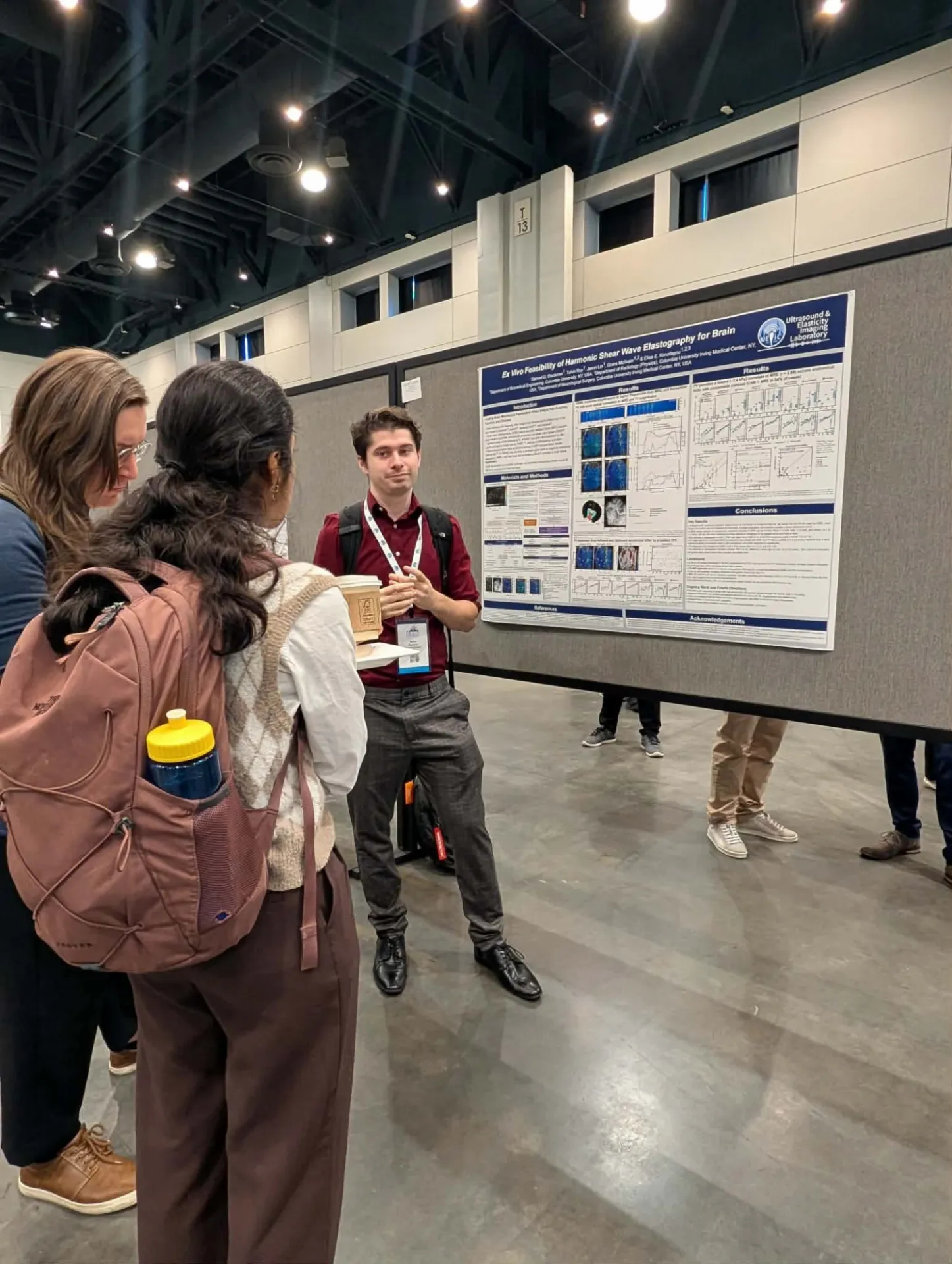 student presenting poster