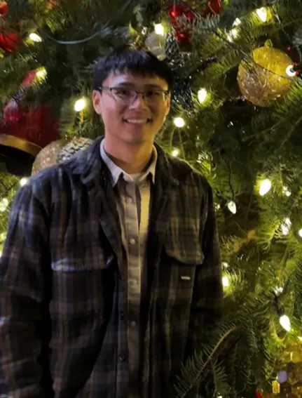PhD student in front of lights
